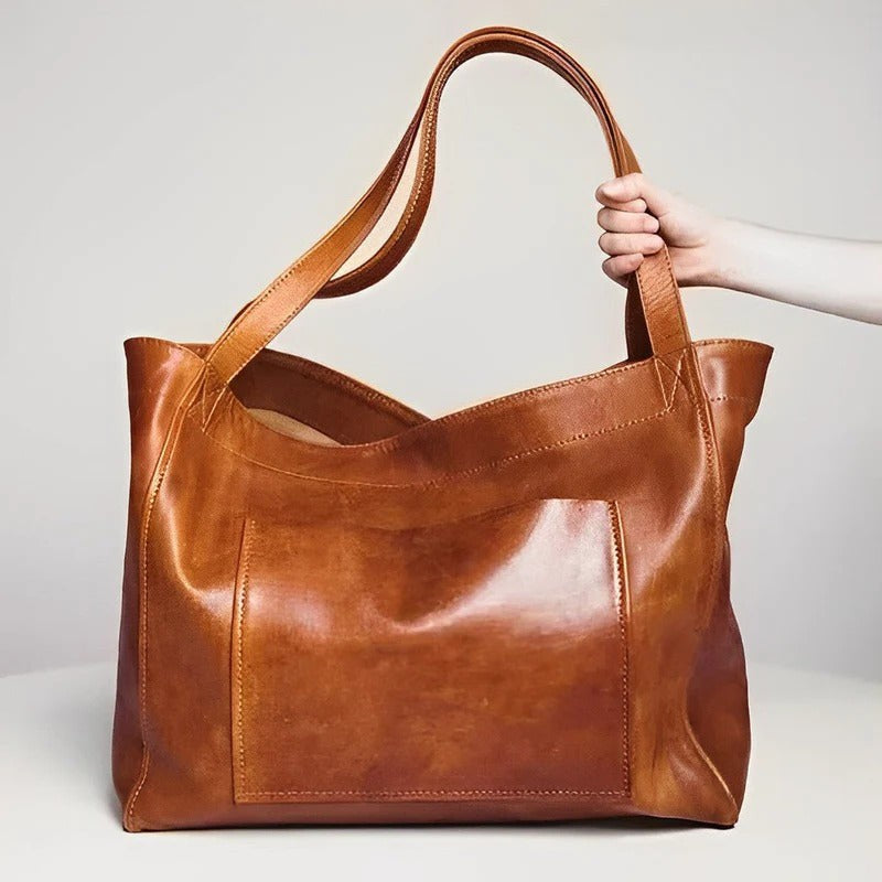 Curved Underarm Hobo Handbag with Minimalist Shoulder Strap and Polished Finish