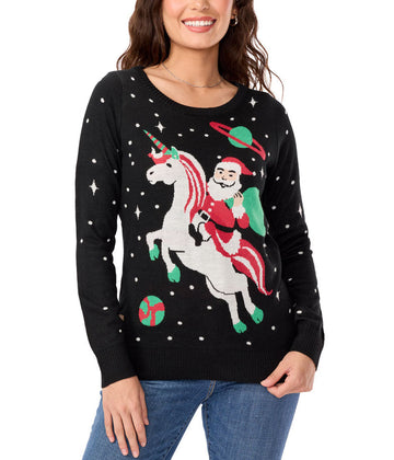 Woman wearing a black sweater with a festive design of Santa riding a unicorn on a white background