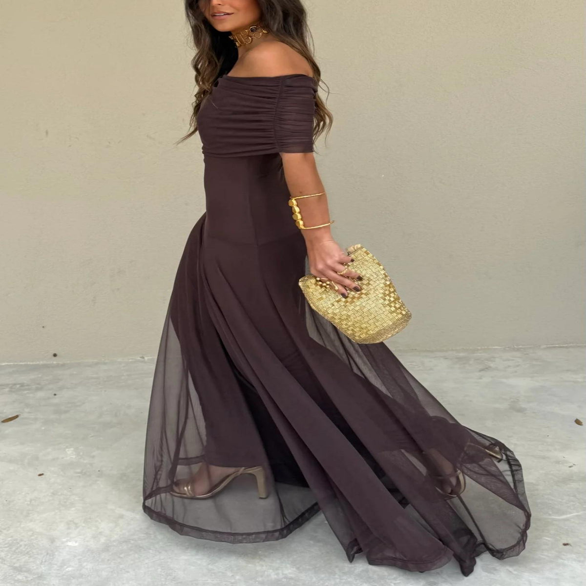 Flowy off-shoulder brown maxi dress for women, offering an elegant and romantic look for evening wear.