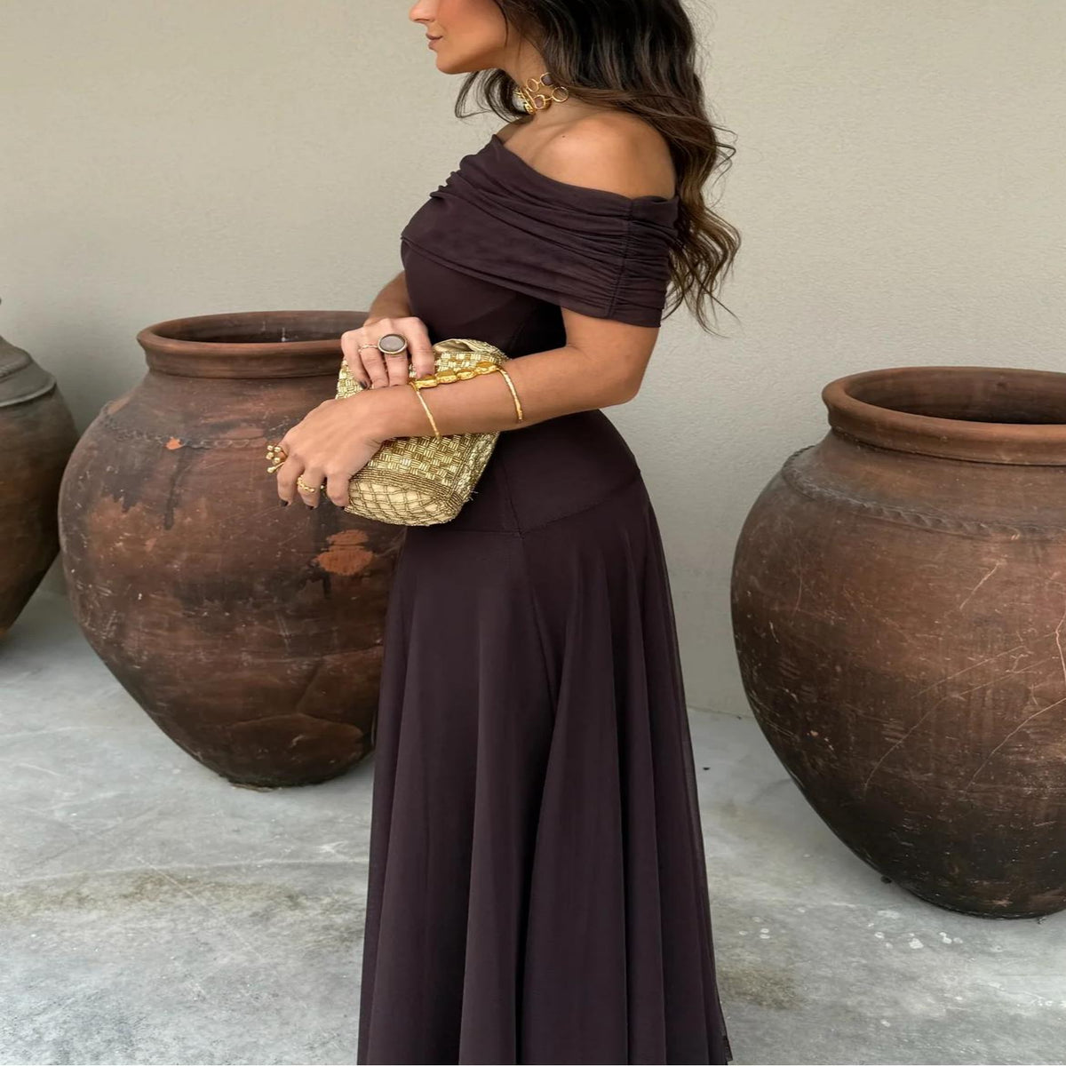 Chic women's brown off-shoulder maxi dress, elegant occasion wear for evening events, parties, and dinners.