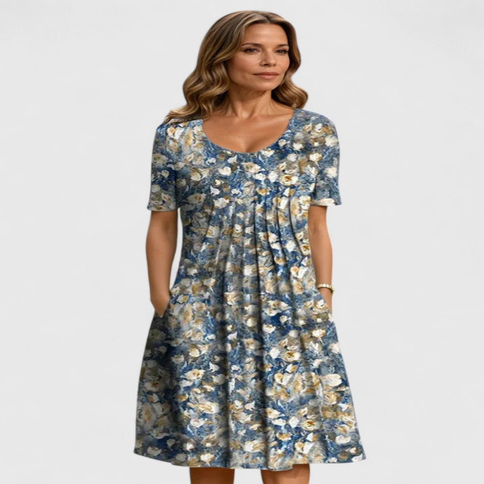 Versatile women's floral summer midi dress; short sleeve, comfortable, with pockets. Ideal for parties or casual outings.