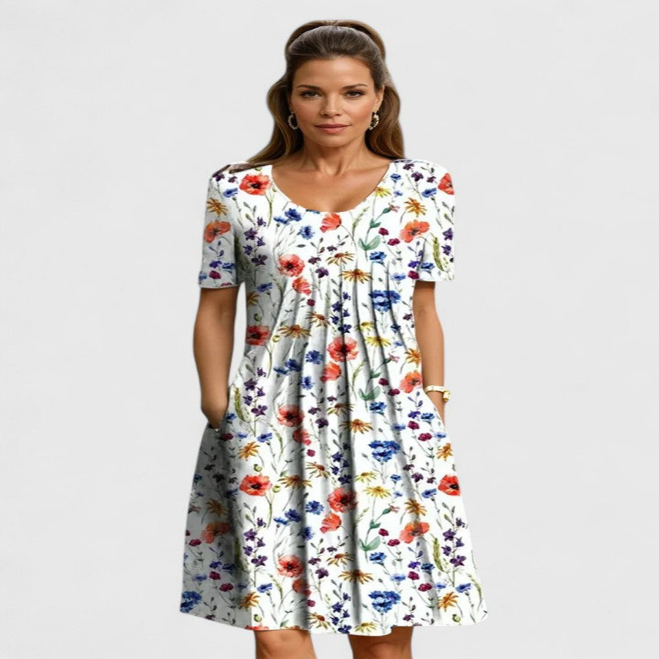 Chic women's short sleeve floral midi dress, perfect for summer. Features a comfortable fit, elegant print, and convenient pockets.