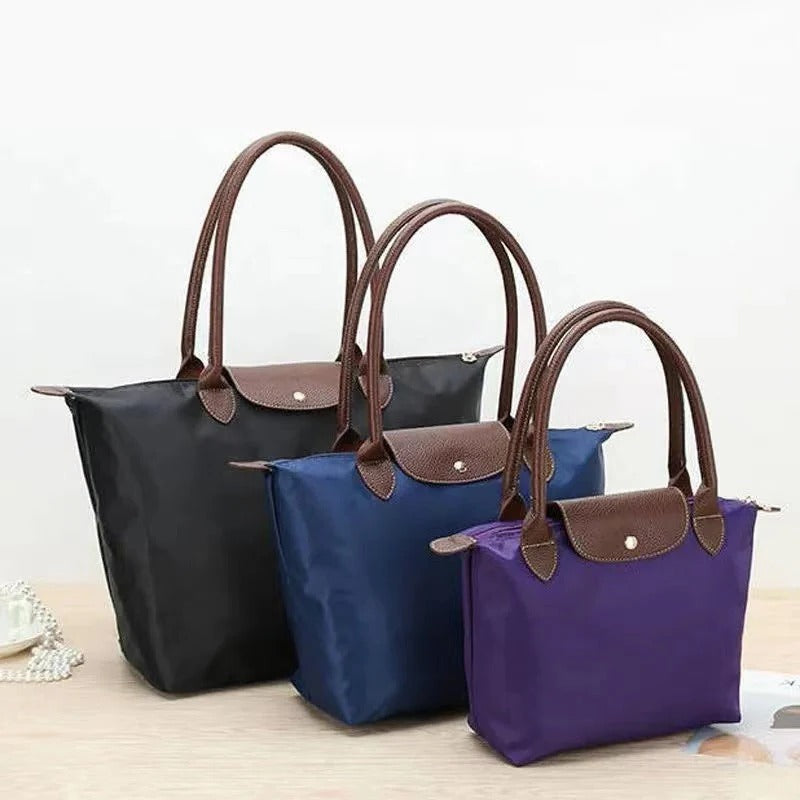 Top Handle Bag with Structured Body and Secure Closure, Compact Design