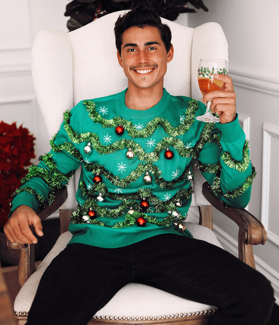 Green Christmas tree-themed sweater with decorations on a white background