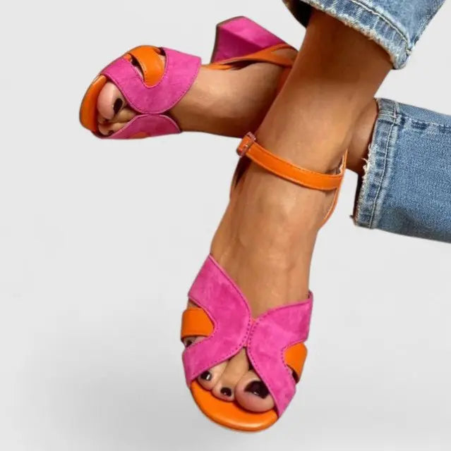 Stylish women's orthopedic block heel sandals, vibrant pink orange with ankle strap for summer comfort.