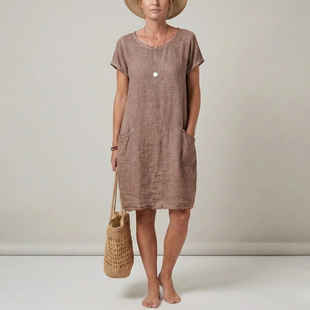 Versatile short sleeve women's mini dress with front pockets. Essential for summer fashion, offering casual comfort.